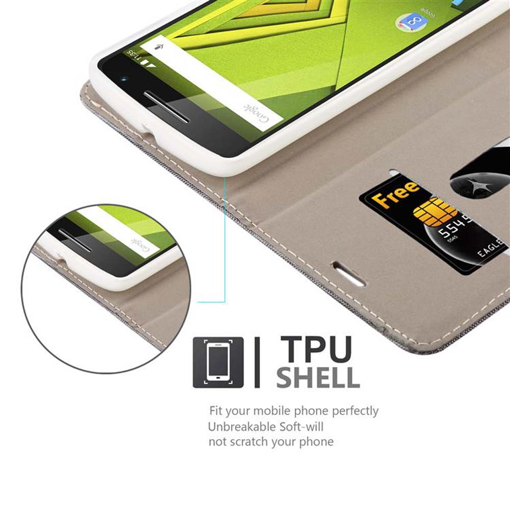 Un telefono in una custodia grigia, aperto, che mostra uno slot per schede e una carta di credito. Il testo 'TPU SHELL' è presente.