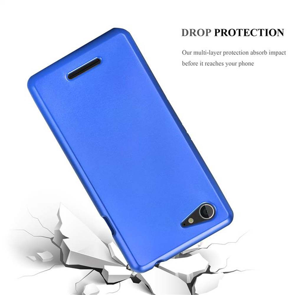 Funda de teléfono azul, cayendo, grietas. Texto DROP PROTECTION. Funda protege el teléfono del impacto.