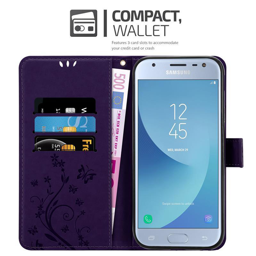 Custodia a portafoglio viola aperta. Il telefono mostra l'ora. Carte e denaro nelle fessure.