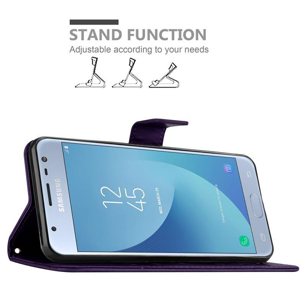 Uno smartphone in una custodia viola. Lo schermo mostra l'ora e la data.