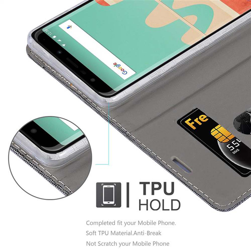 Ein Telefon in einer grauen Hülle, offen, mit Kartensteckplatz und Kreditkarte. Der Text „TPU HOLD“ wird angezeigt.