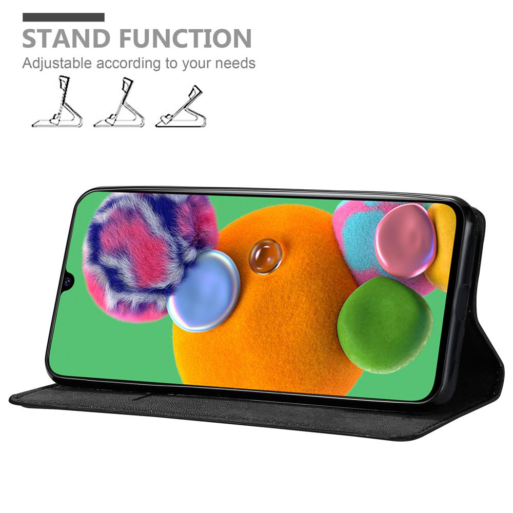 Telefono in custodia nera con funzione stand, che mostra arte astratta colorata sullo schermo.