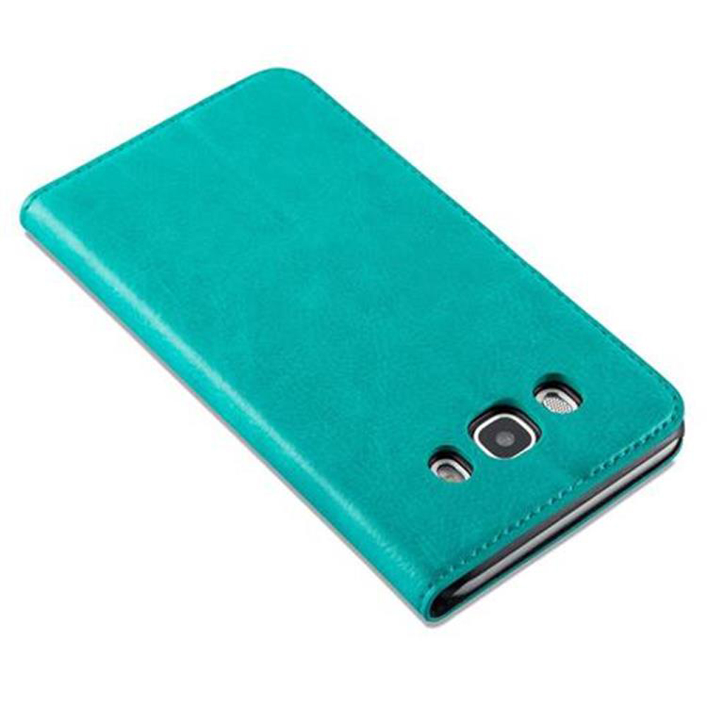 Custodia per telefono verde acqua con una fotocamera. Sembra chiuso.