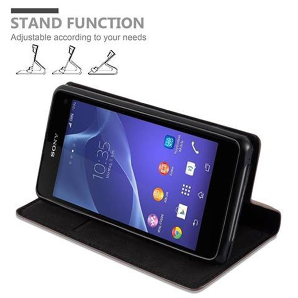 Schwarzes Telefon in einem Gehäuse, hochgeklappt. Telefon zeigt Oberfläche. Standfunktion.