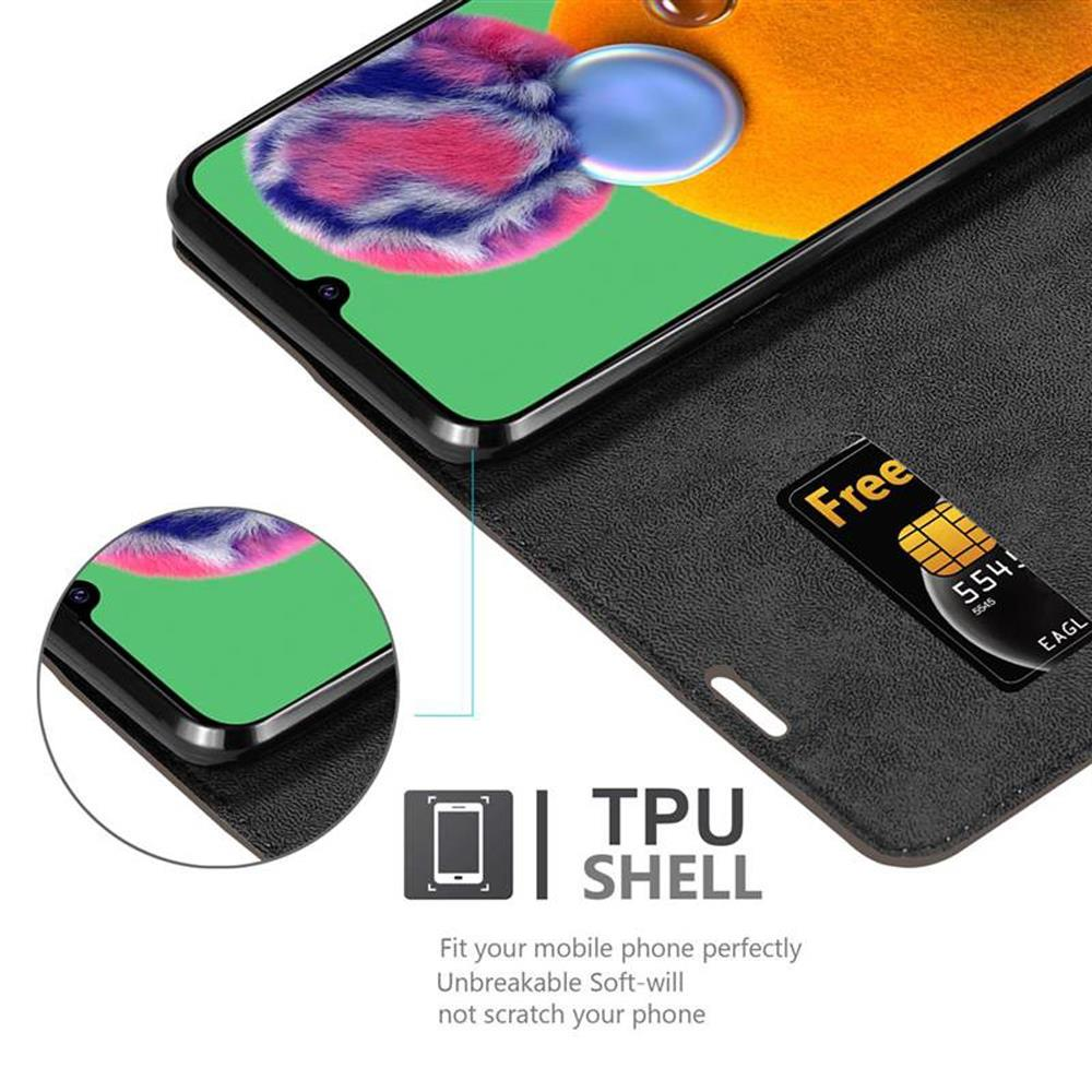 Telefono e una carta in una custodia. Il testo dice 'TPU SHELL'. Lo schermo è visibile.