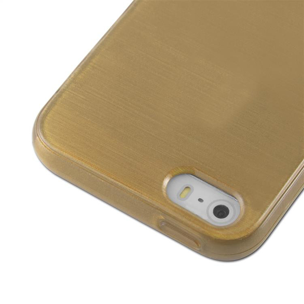 Una custodia dorata per telefono con un foro per la fotocamera nell'angolo.