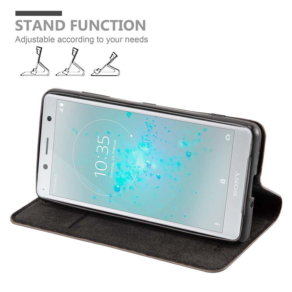 Un telefono in una custodia, sollevato per la visualizzazione. La funzione stand è evidenziata. L'ora viene visualizzata.