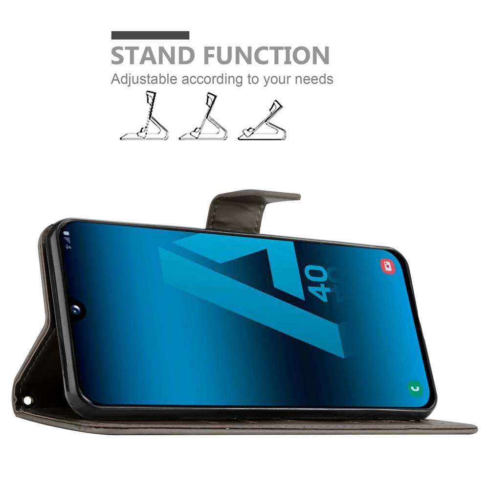 Schwarzes Telefon in einem schwarzen Gehäuse, zum Aufstellen aufgestellt. Text sagt: "STAND FUNCTION".