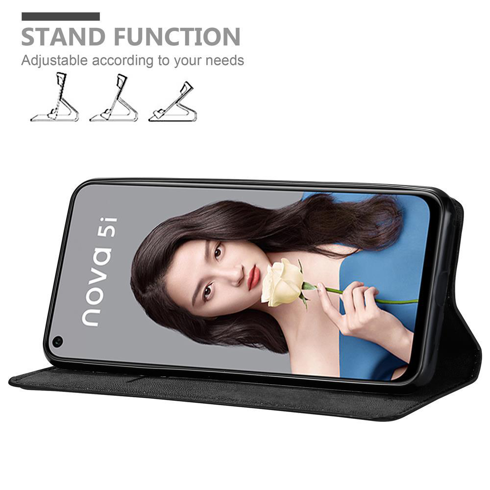 Custodia nera per telefono con telefono che mostra il volto di una donna. Viene mostrata la funzione stand.