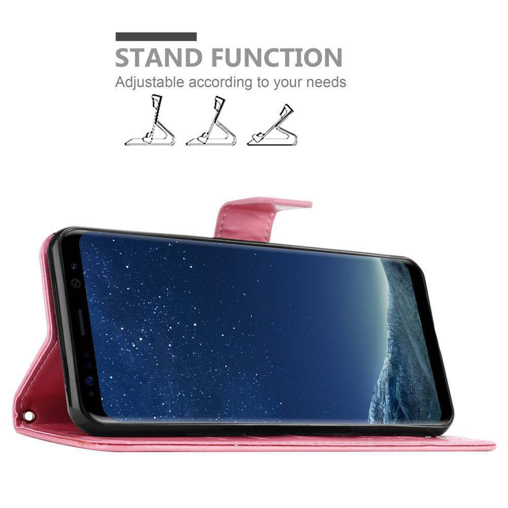 Custodia rosa per telefono in modalità stand. Il telefono ha uno sfondo blu con stelle. La custodia è rosa.