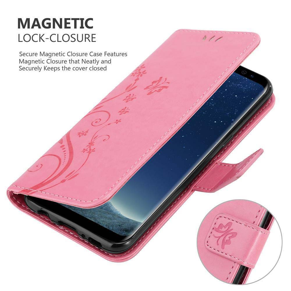 Custodia per telefono rosa con telefono all'interno. Design floreale sulla copertina. Chiusura magnetica.