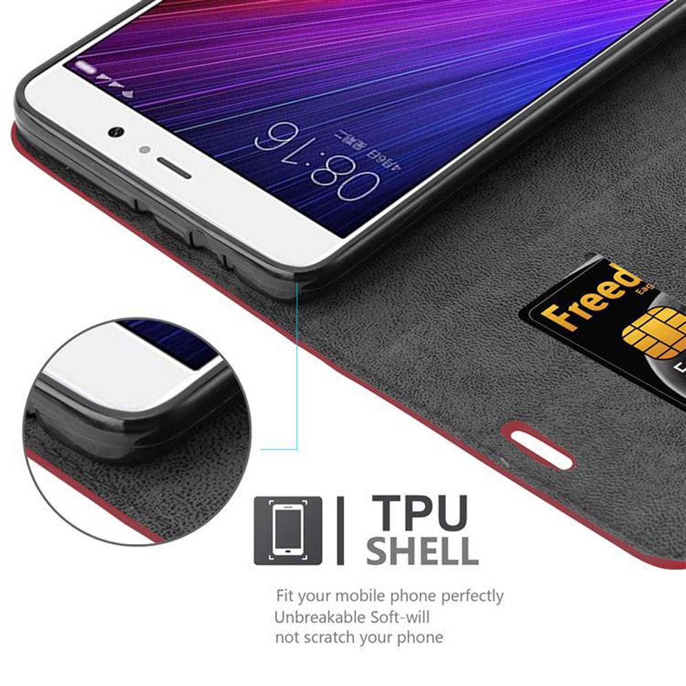 Un teléfono en una funda negra, con una tarjeta de crédito y texto que dice TPU Shell.