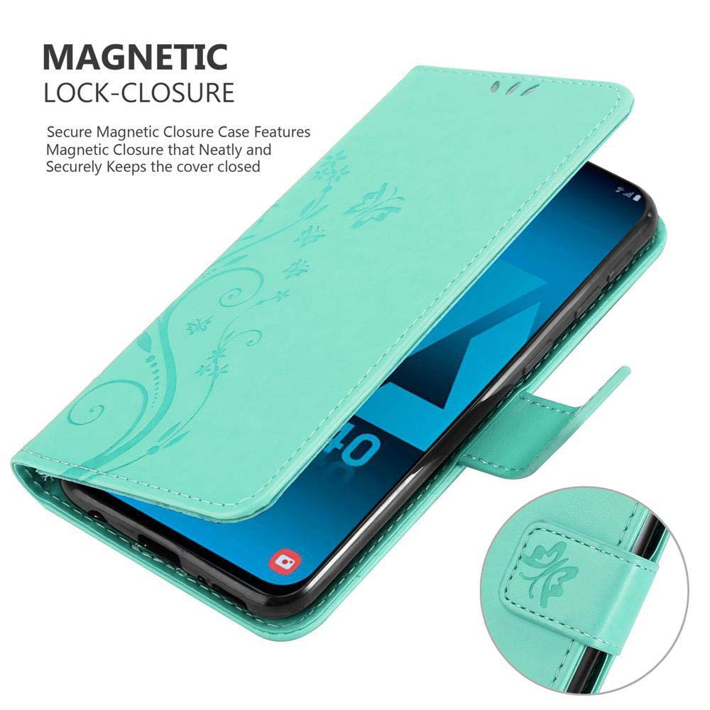 Eine türkis Handyhülle mit floralem Design, geöffnet, um einen Telefonbildschirm zu zeigen. Magnetverschluss.