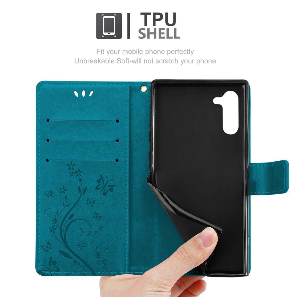 Türkisfarbene Handyhülle, geöffnet, mit einem Telefon. Das Telefon ist schwarz. Die Hülle hat ein Blumenmuster.