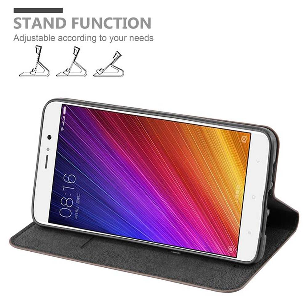 Un teléfono con pantalla colorida, dentro de una funda. Arriba dice función soporte.