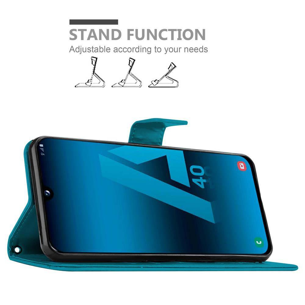 Telefon in einer Hülle. Der Bildschirm zeigt eine blaue Grafik. Text 'Stand Function'.