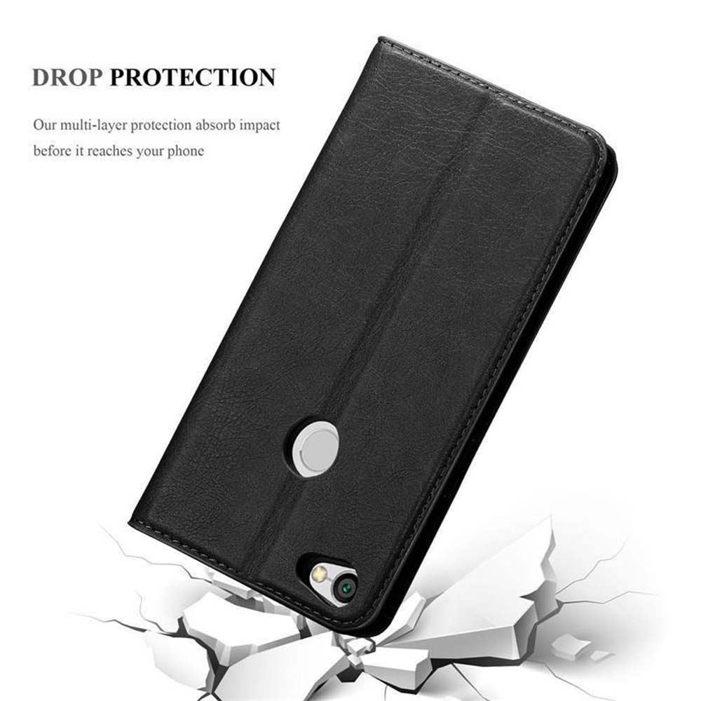 Custodia per telefono nera leggermente aperta, telefono all'interno. Immagine della custodia con crepe sottostanti. Protezione dalle cadute pubblicizzata.