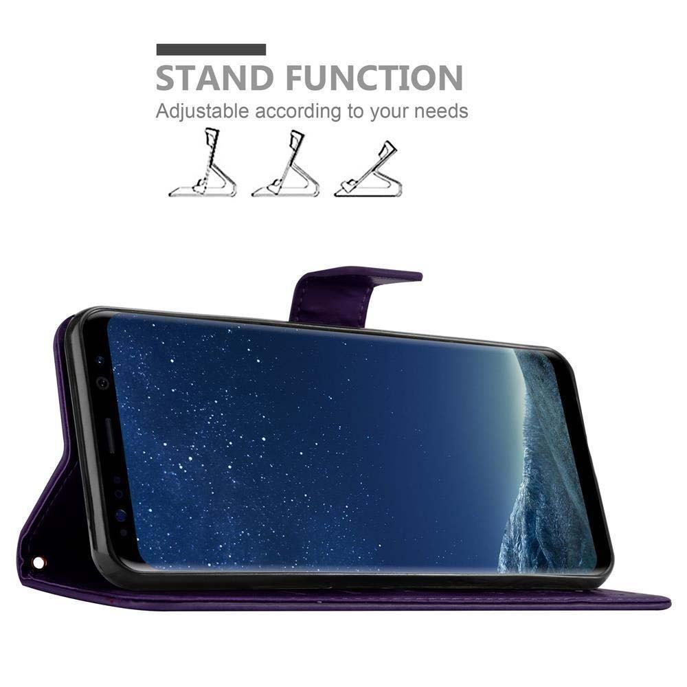 Custodia per telefono viola con telefono all'interno, aperta. Mostra la funzione stand. Schermo con stelle.