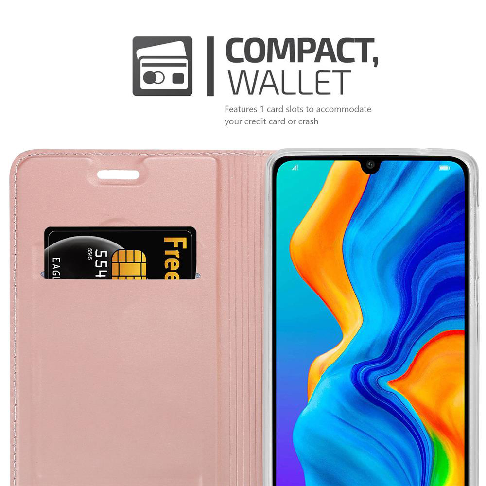 Un telefono in una custodia con carta di credito. La custodia è rosa, la carta è visibile.