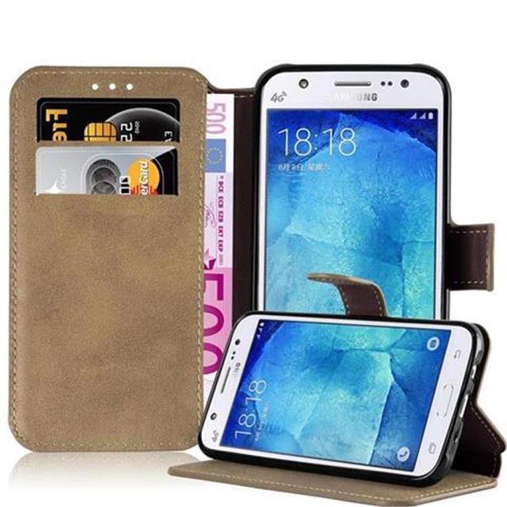 Funda de teléfono con tarjetas y dinero dentro. Dos teléfonos están en la funda.
