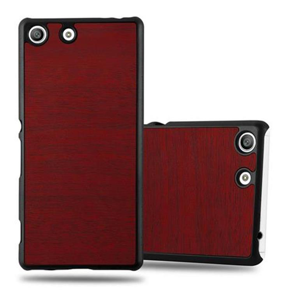 Dos fundas burdeos para teléfono. Los teléfonos tienen un diseño de madera roja. Las fundas tienen agujeros para la cámara.