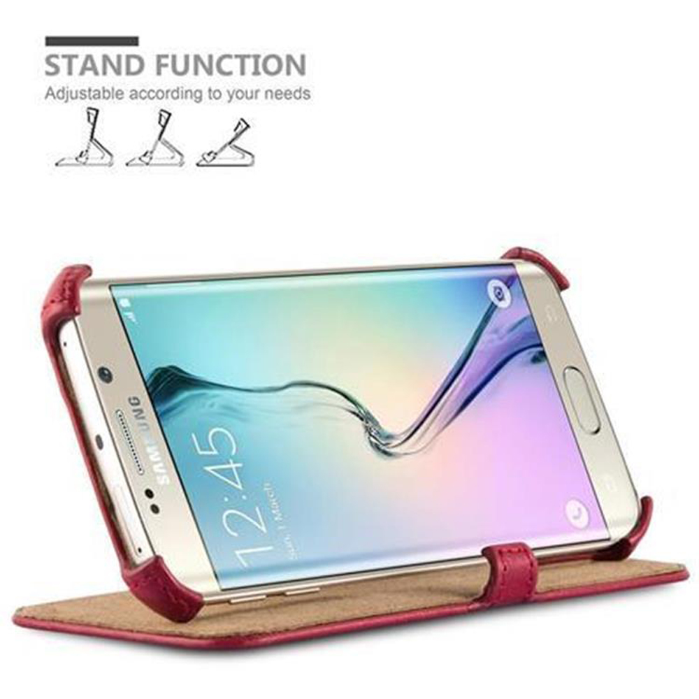 Telefono in una custodia rossa, schermo che mostra l'ora. La custodia è appoggiata, in posizione stand.