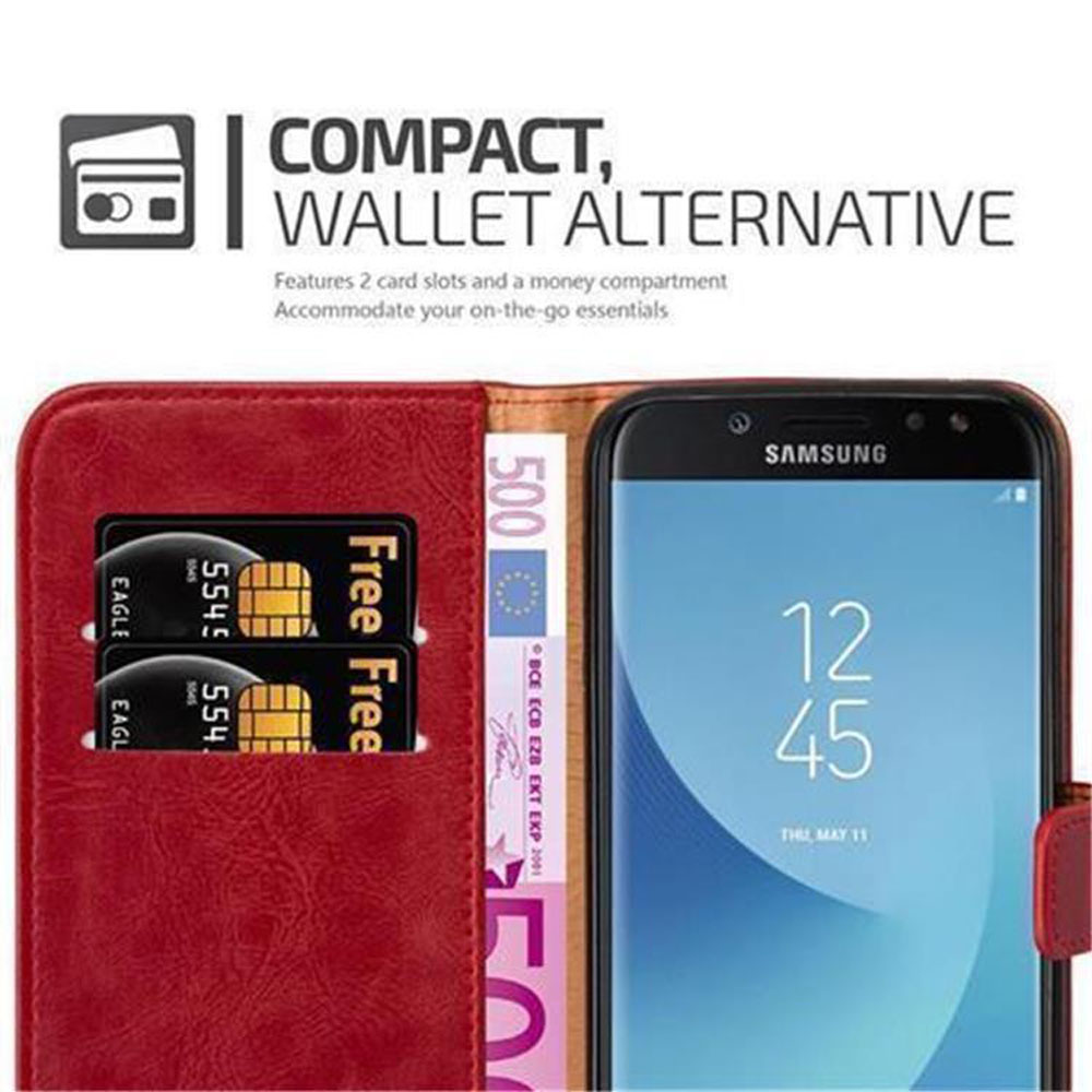 Una custodia per telefono rossa con un telefono all'interno. La custodia ha carte di credito e denaro. Il telefono è acceso.