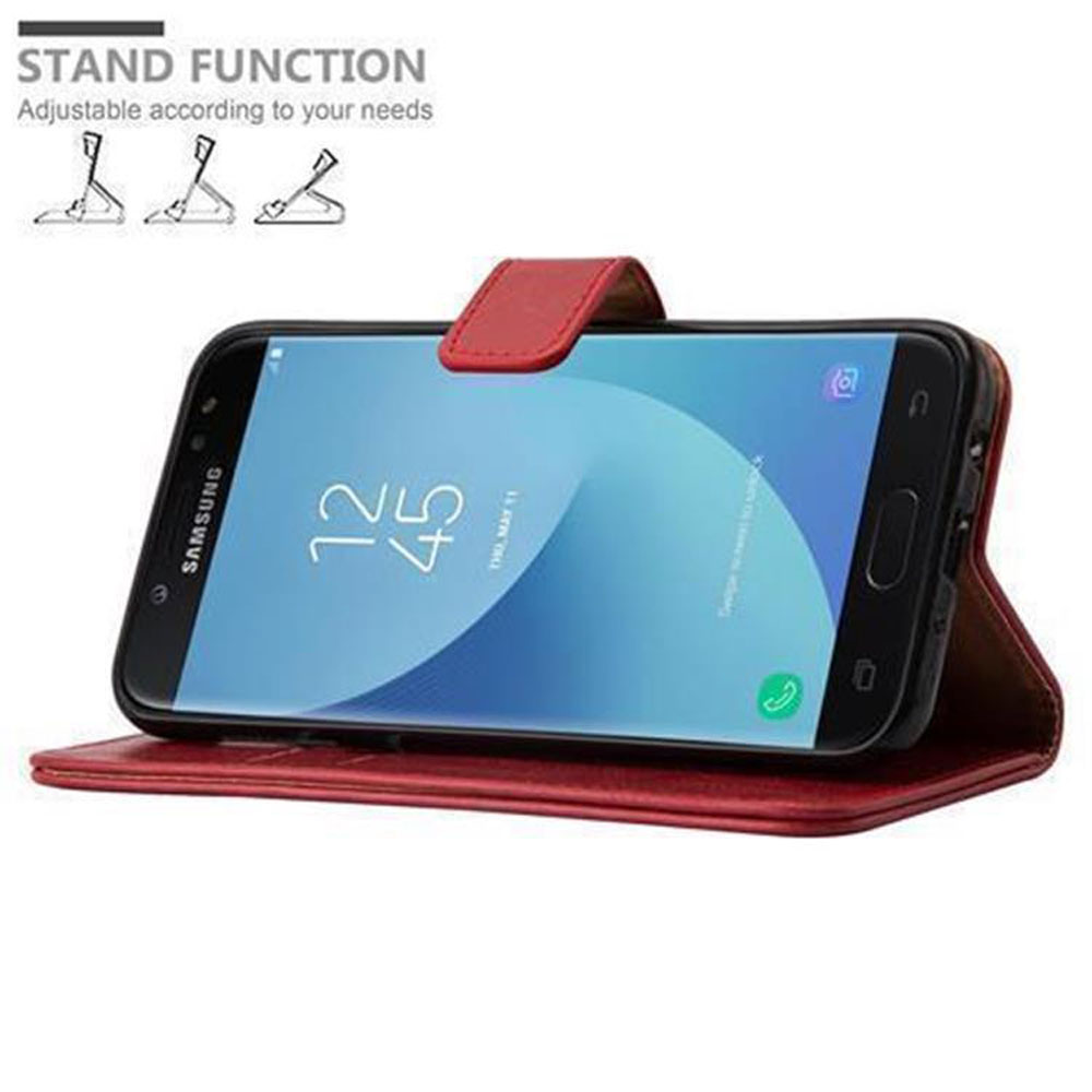 Un telefono in una custodia rossa che può fungere da supporto. La funzione di supporto è mostrata. Il telefono è sulla custodia.