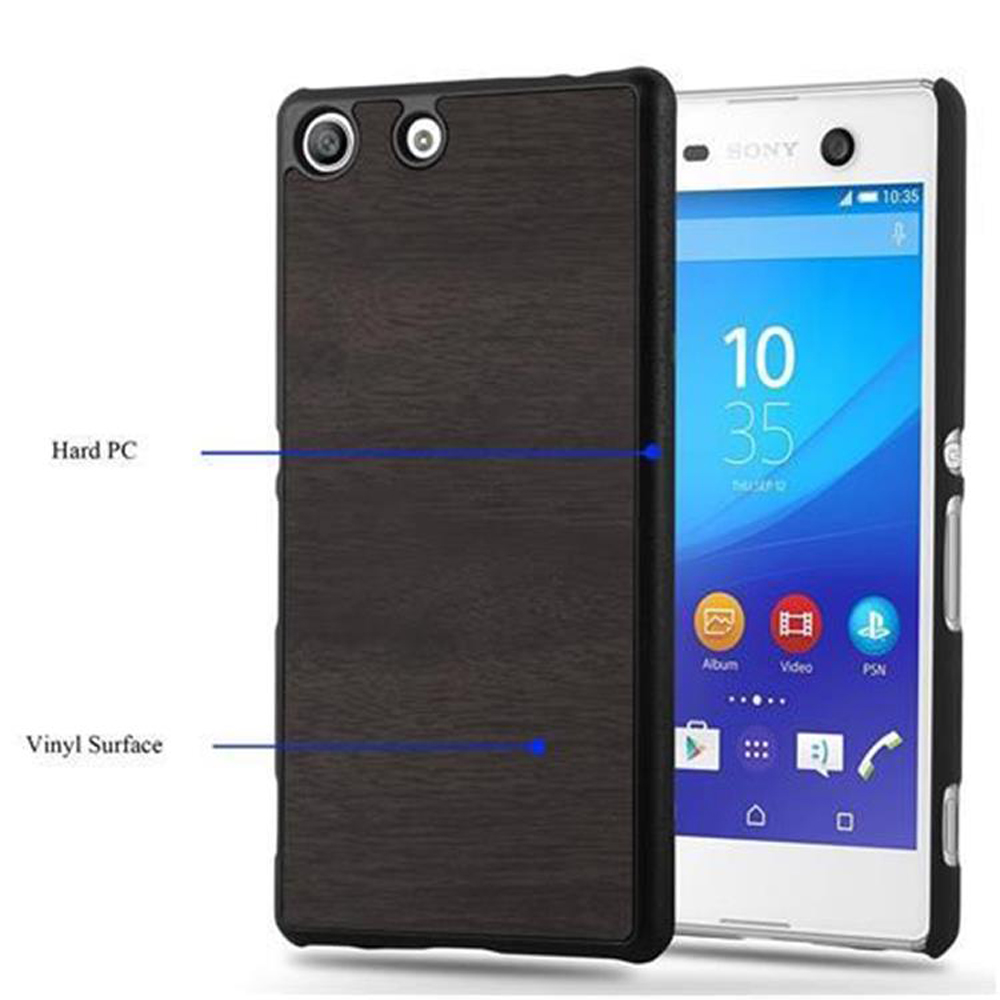 Funda de teléfono con vetas de madera en un lado, teléfono blanco en el otro. Texto: Hard PC, Vinyl Surface.