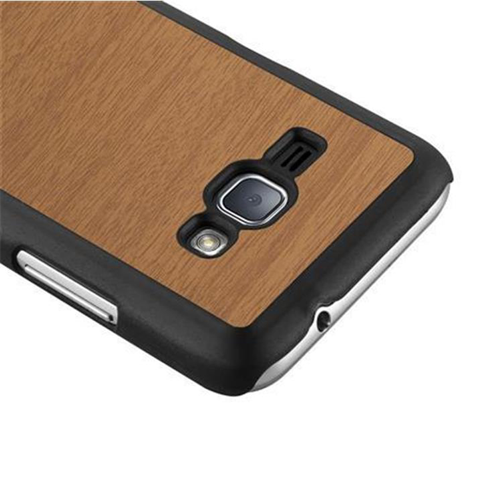 Retro del telefono con trama legno. Cornice nera attorno al telefono.