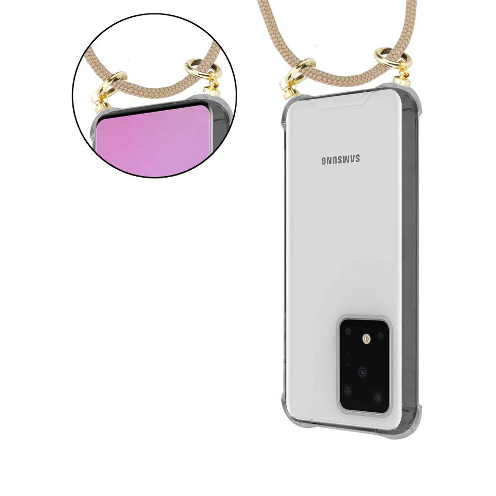 Un telefono con una custodia trasparente, appeso a una corda, con dettagli dorati.