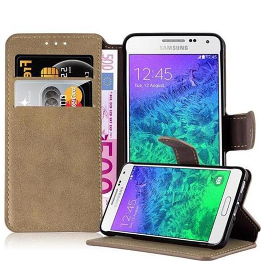Una funda de teléfono abierta, que muestra un teléfono, tarjetas de crédito y efectivo. Otro teléfono está debajo.