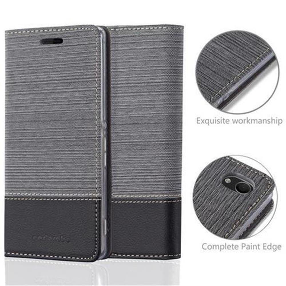 Una funda de teléfono con diseño gris y negro. Se muestran detalles de las costuras y materiales.