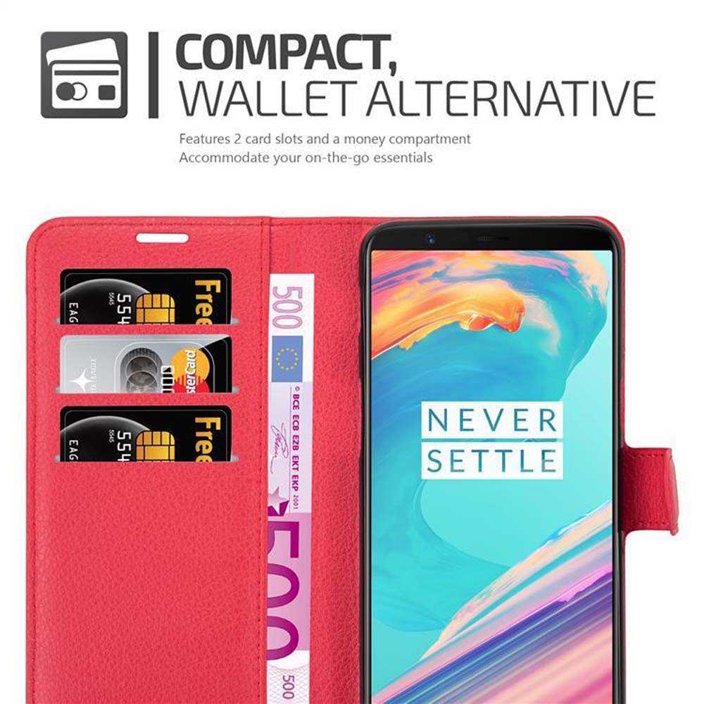 Eine rote Brieftaschen-Handyhülle mit Kreditkarten und einem 500-Euro-Schein und einem Telefon.
