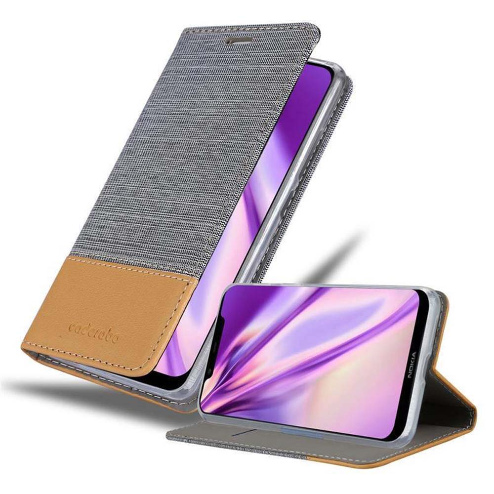 Graue Handyhülle geöffnet, Handy sichtbar. Hülle ist grau und braun. Telefon ist innen sichtbar.