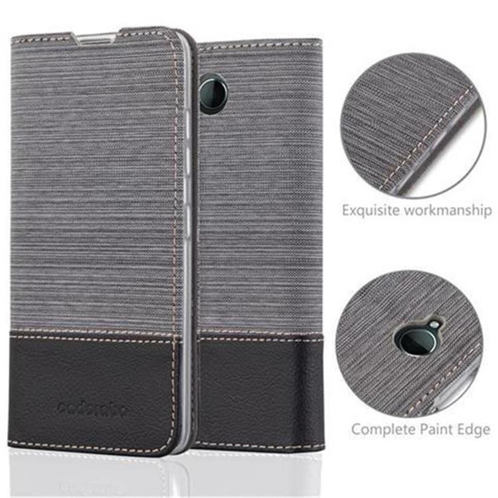 Funda de teléfono gris y negra. Detalles muestran costuras y orificio de cámara.