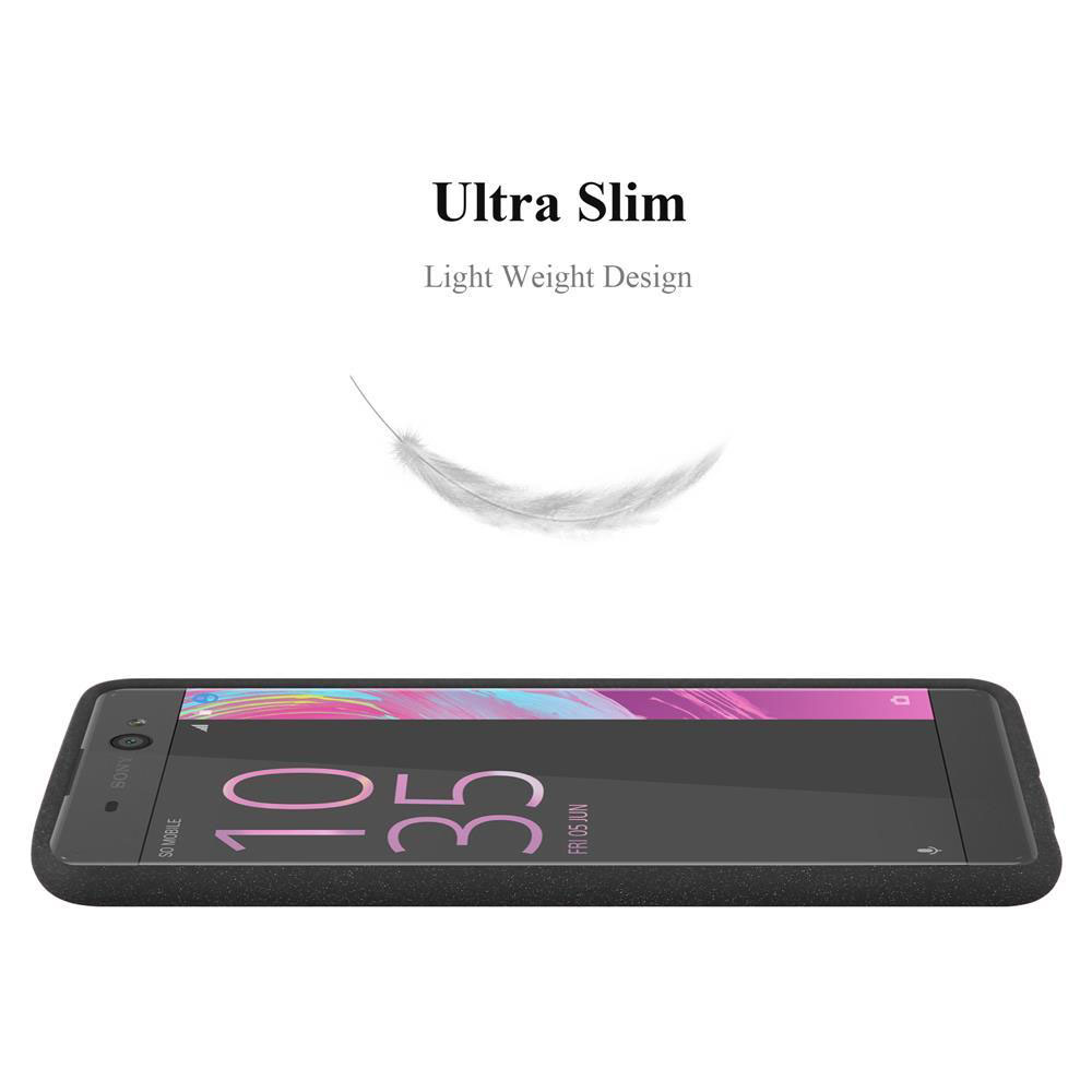 Un telefono appoggiato su una superficie. La custodia è nera con una piuma leggera sullo sfondo. Design ultra sottile.