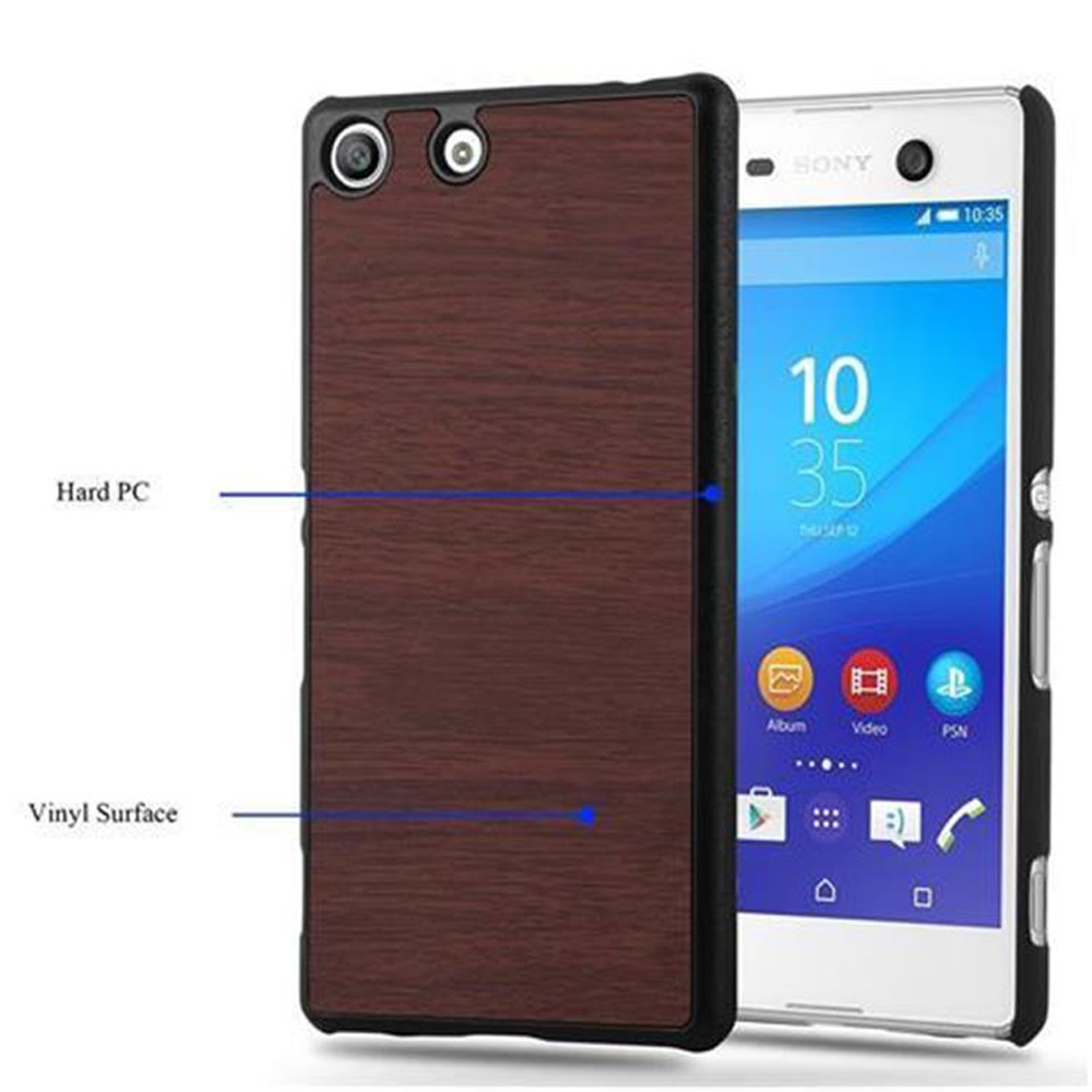 La imagen muestra un teléfono en una funda con patrón de madera, con etiquetas 'Hard PC' y 'Vinyl Surface'.
