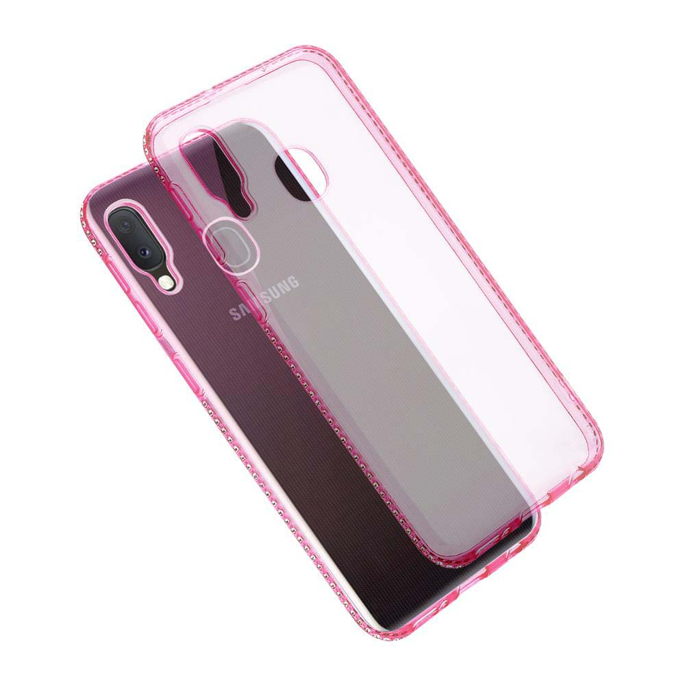 Un telefono è in una custodia rosa trasparente. La custodia del telefono è sopra il telefono.