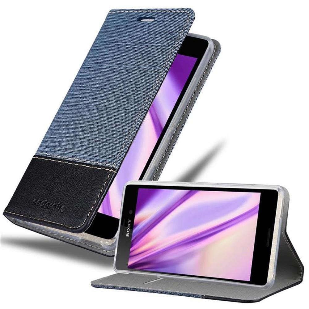 Un teléfono en una funda de tela azul y cuero negro, el teléfono está abierto.