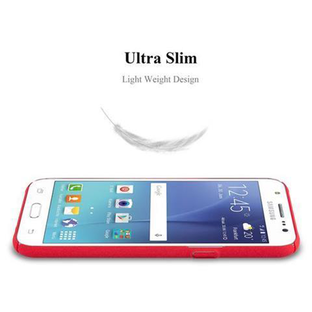 Ein weißes Telefon mit roter Hülle und einer Feder darüber.
