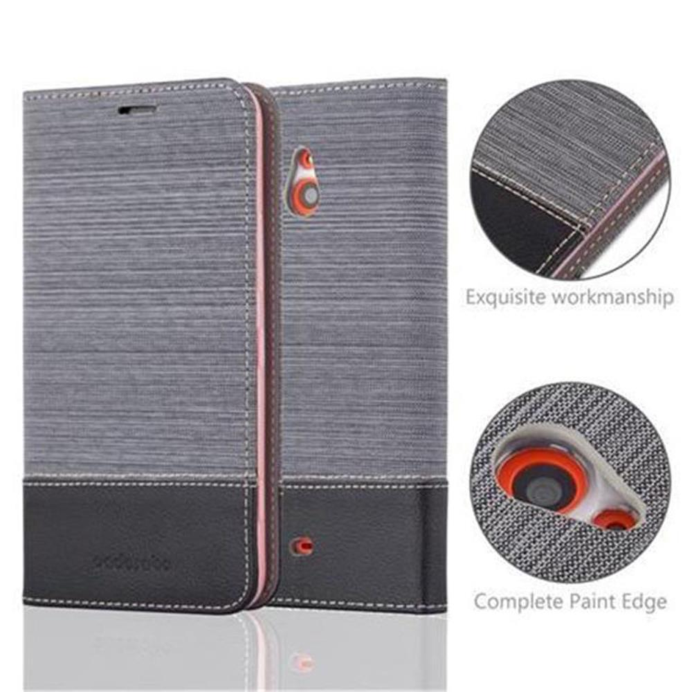 Étui de téléphone gris avec base noire. Les détails incluent les coutures, les gros plans et le texte.