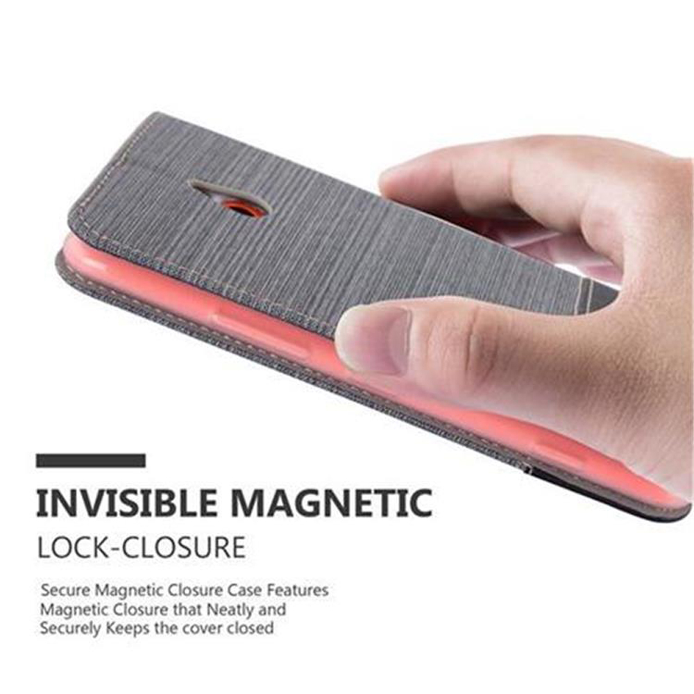 Une main tenant un étui de téléphone gris avec un téléphone rouge à l'intérieur. L'étui montre une fermeture magnétique.
