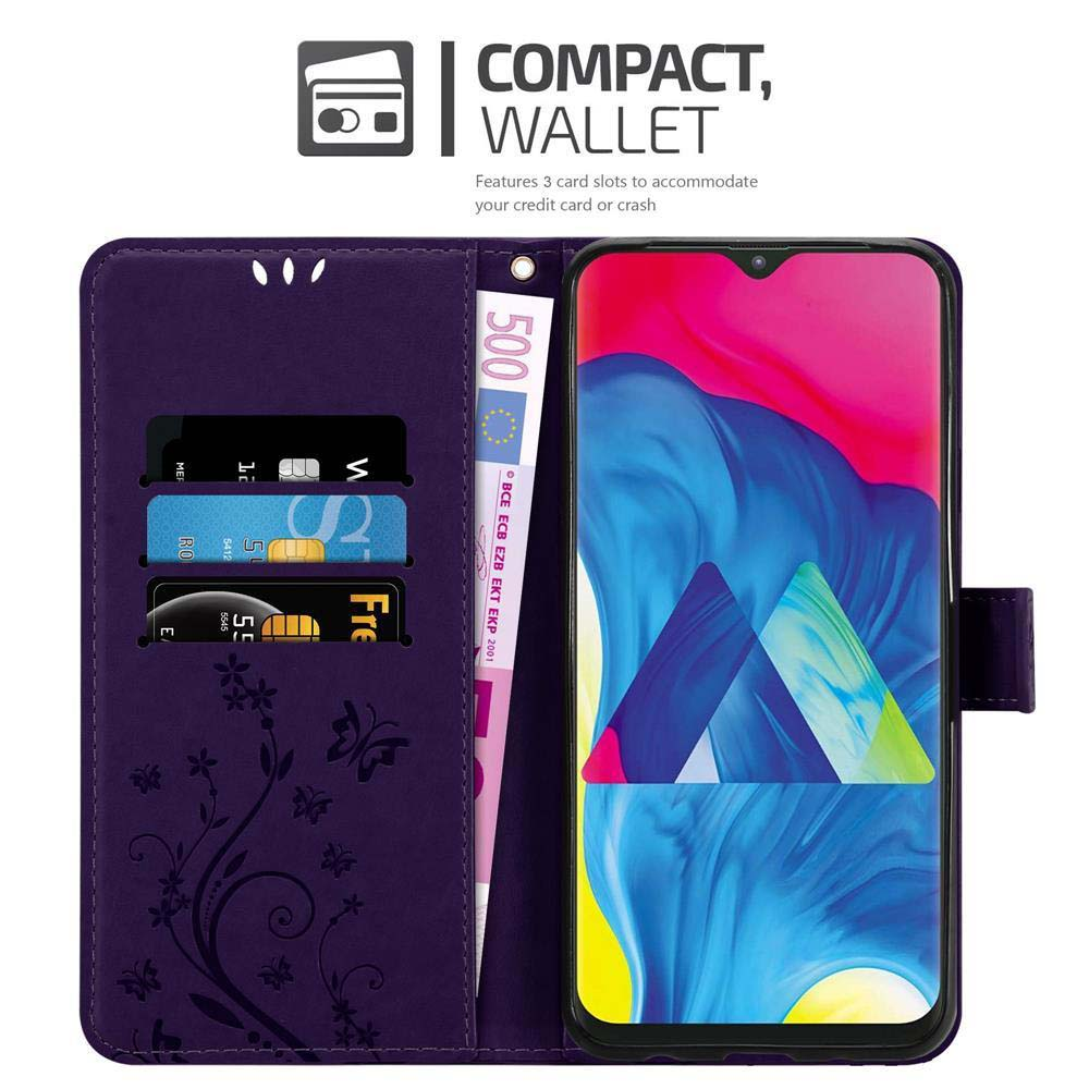 Una custodia per telefono viola con carte e denaro, con un telefono visibile.
