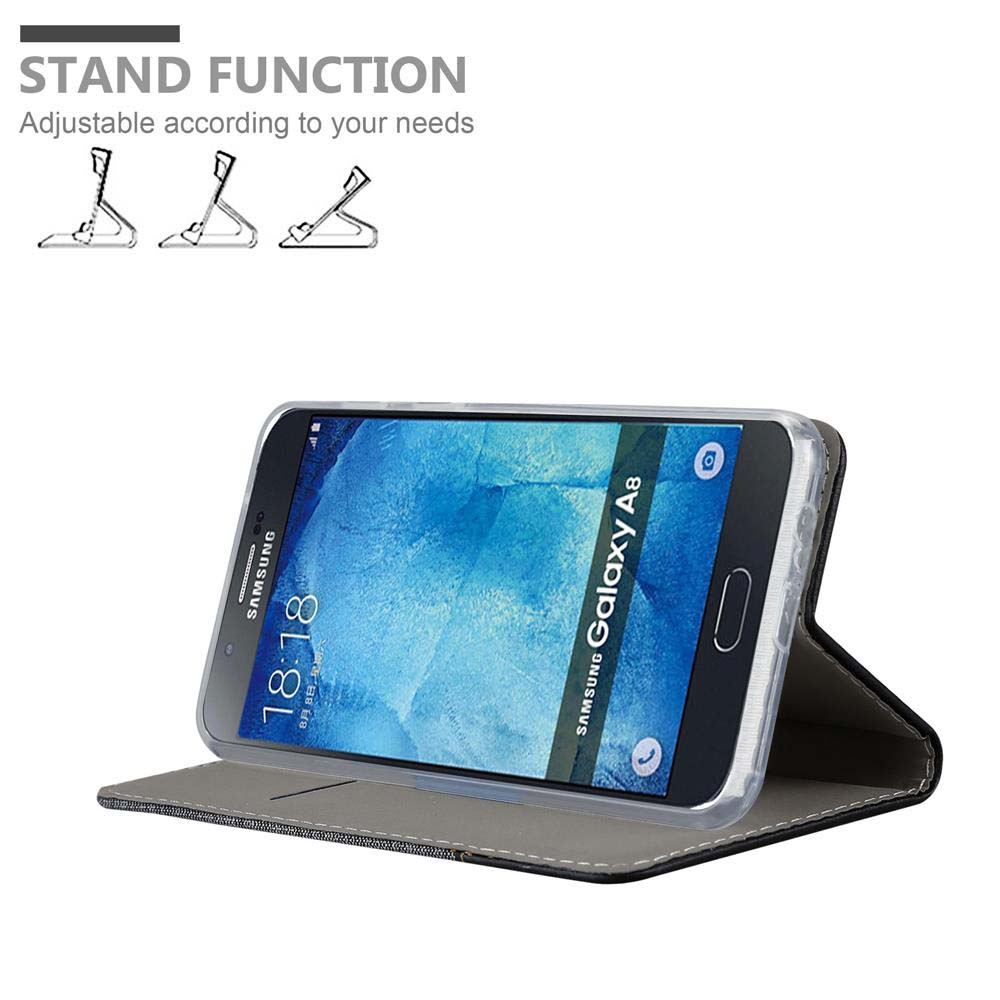 Telefono in custodia con supporto, nero e grigio, schermo Samsung Galaxy A8 visibile. Testo funzione supporto sopra.
