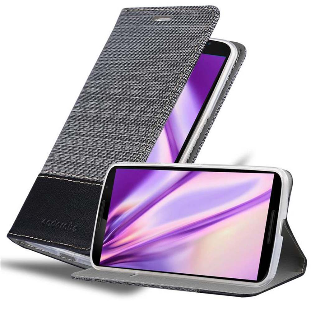 Teléfono en funda gris y negra, abierto. Otro teléfono está en una funda en la parte inferior. Pantalla morada.