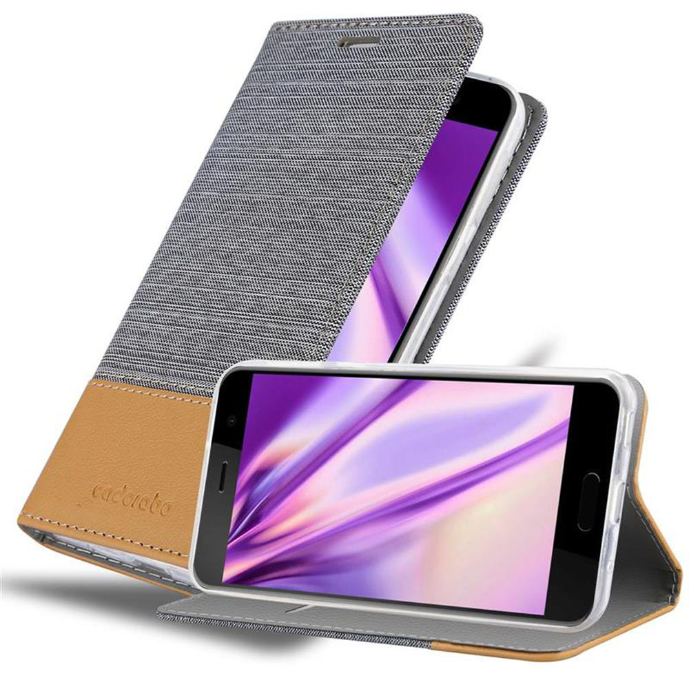 Due telefoni nelle custodie. Uno aperto con schermo viola, l'altro chiuso con tessuto grigio e pelle marrone.
