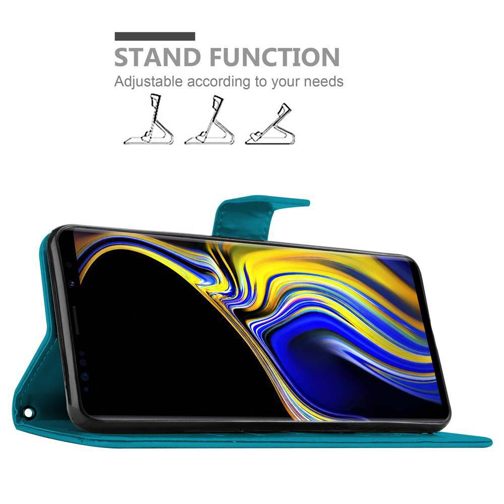 Eine türkisgrüne Handyhülle, geöffnet, mit einem Telefonbildschirm. Oben steht 'STAND FUNCTION'.