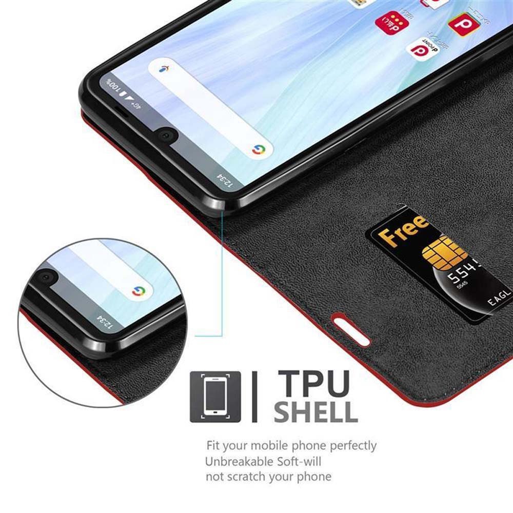 Telefono in custodia a libro aperta. Schermo nero sopra, con SIM card omaggio.