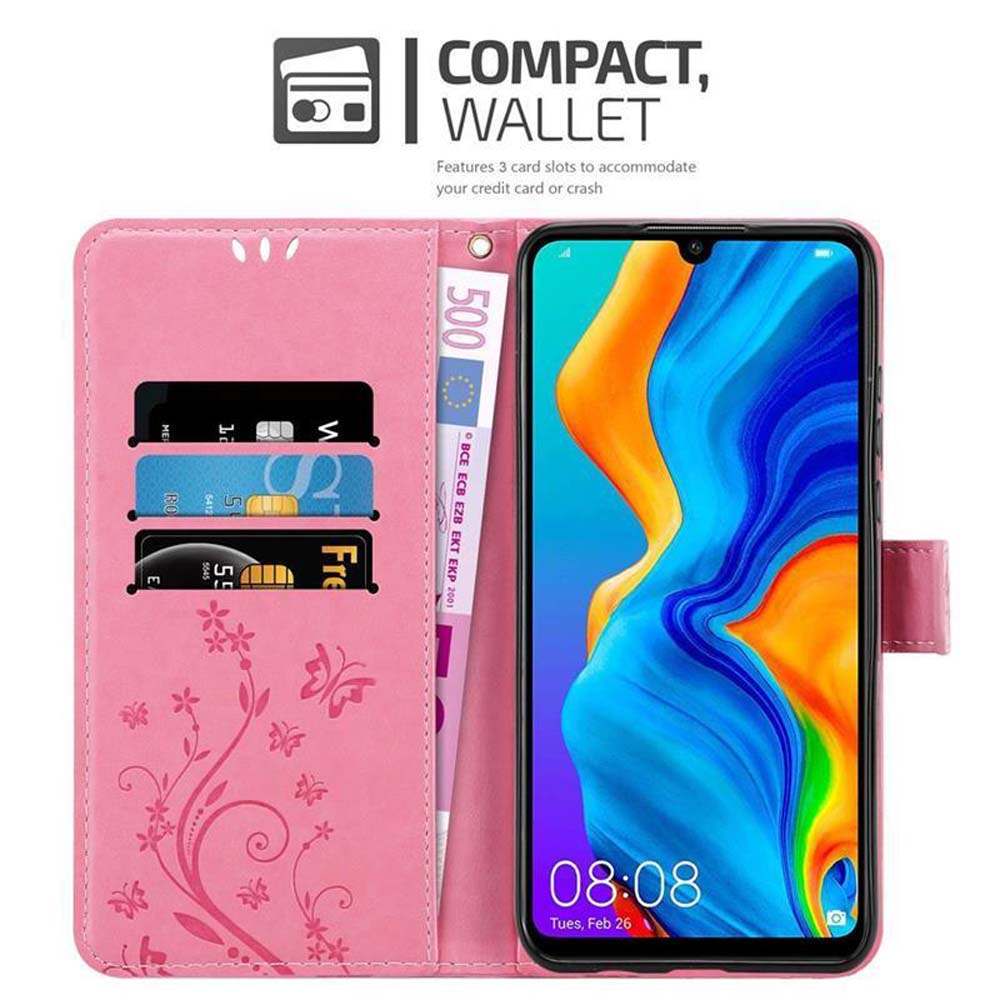 Custodia rosa con telefono e carte. Banconota mostrata a sinistra.